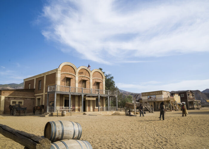 TABERNAS DESERT, ALMERIA, SPAIN - September 19, 2014: filming cowboy duel for a western movie. Wild west town set.